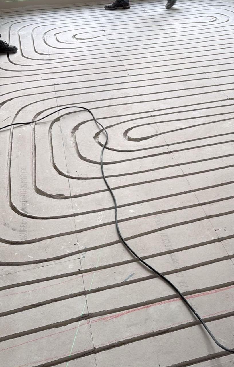 Close-up of underfloor heating pipes on a floor